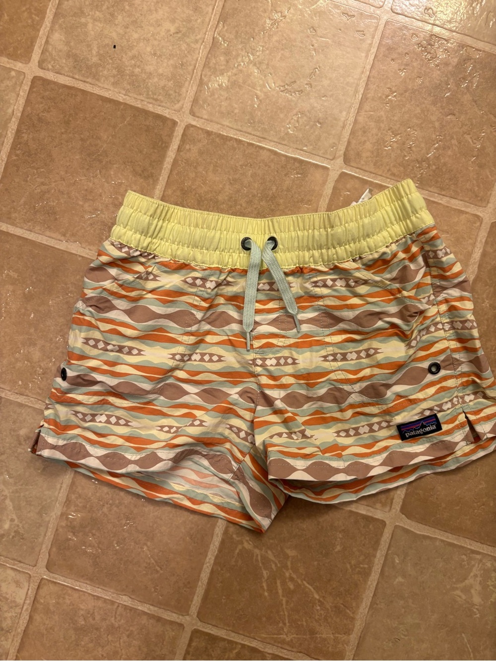 Patagonia Pale Yellow Swim Shorts with Pastel Wave Lining